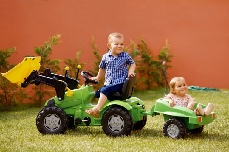 little boy riding john deere tractor